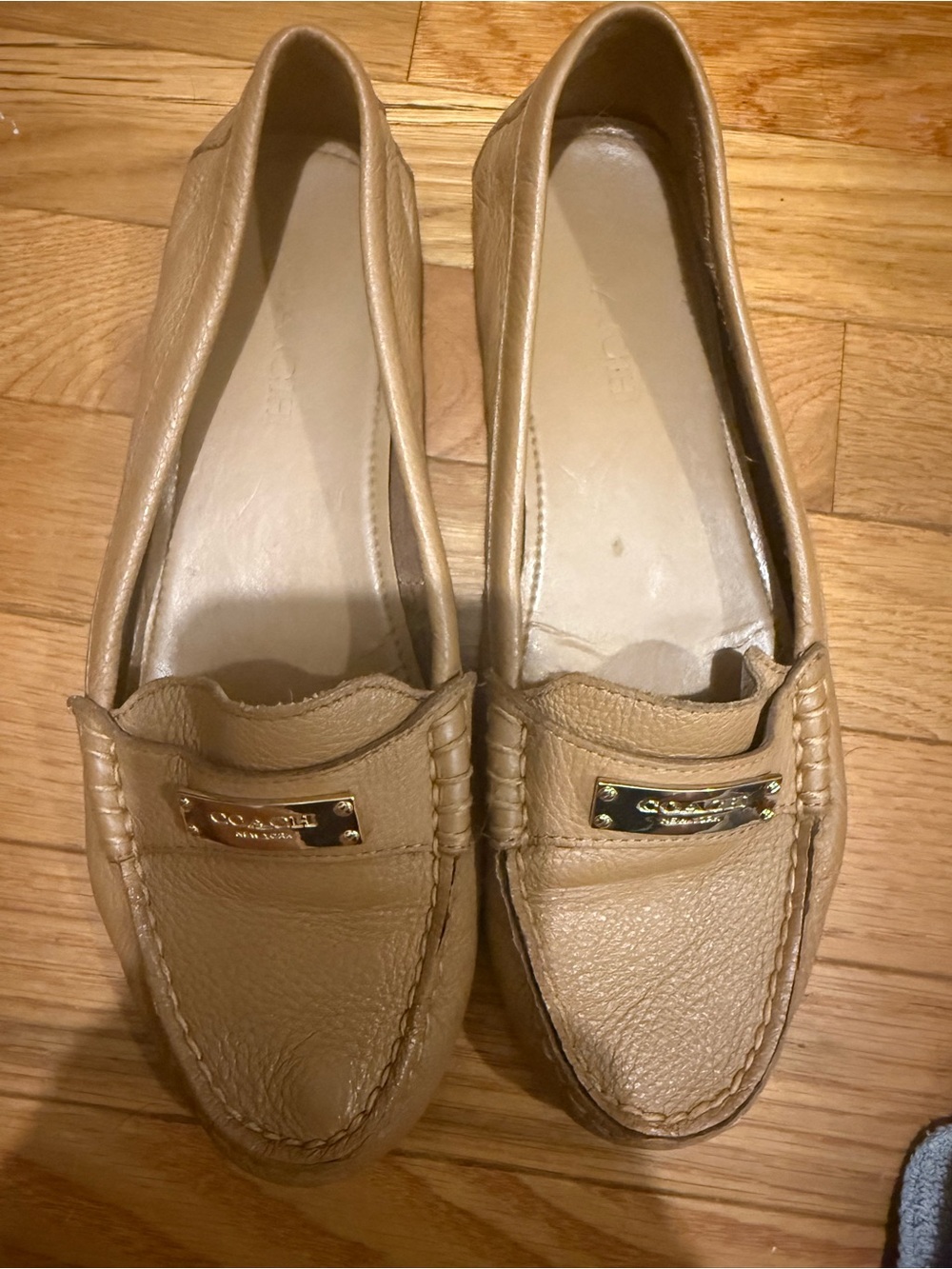 Coach Women's Beige/Tan Leather Slip-On Loafers with Gold Plaque